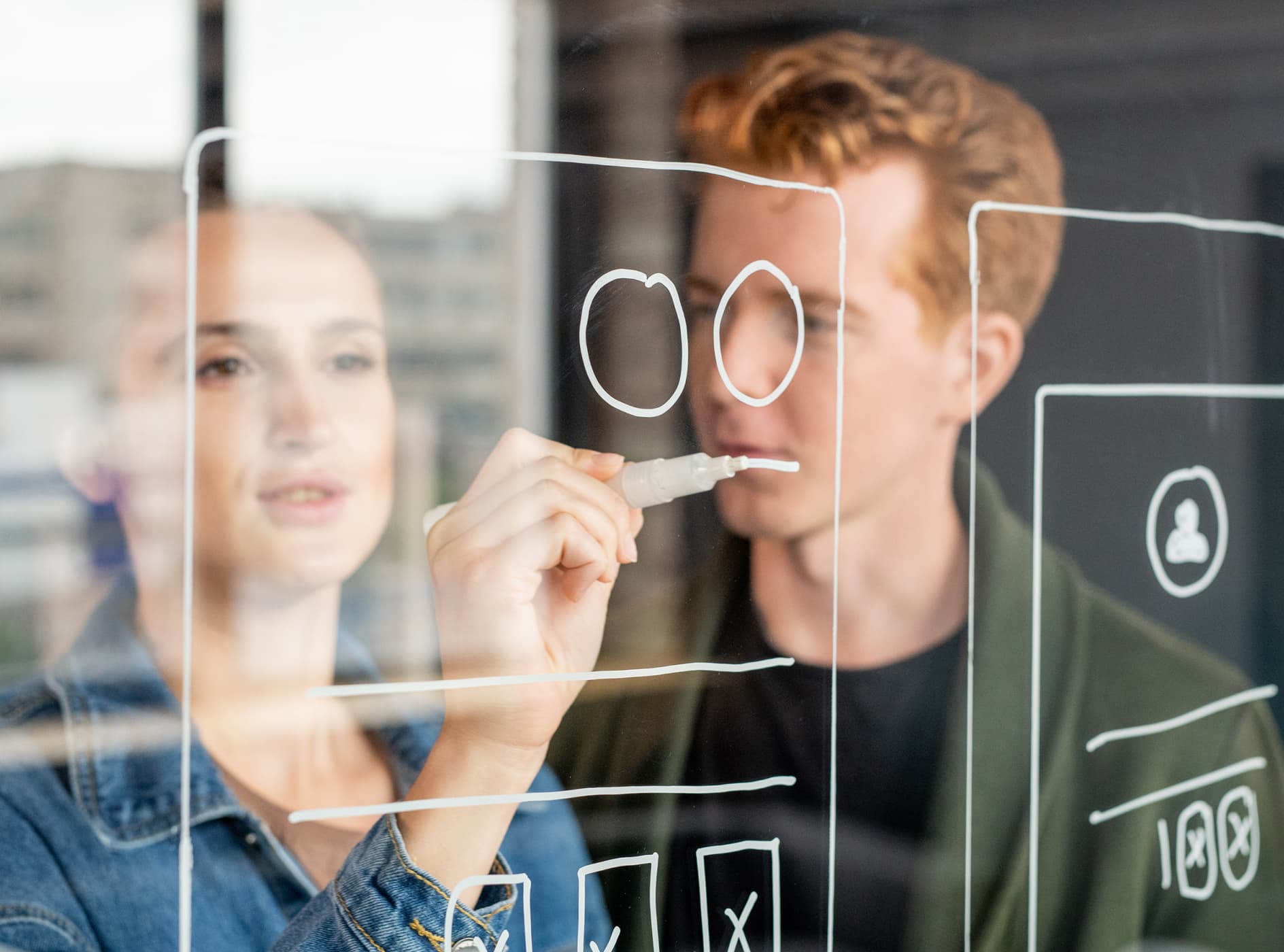 hand-of-young-female-software-developer-drawing-sk